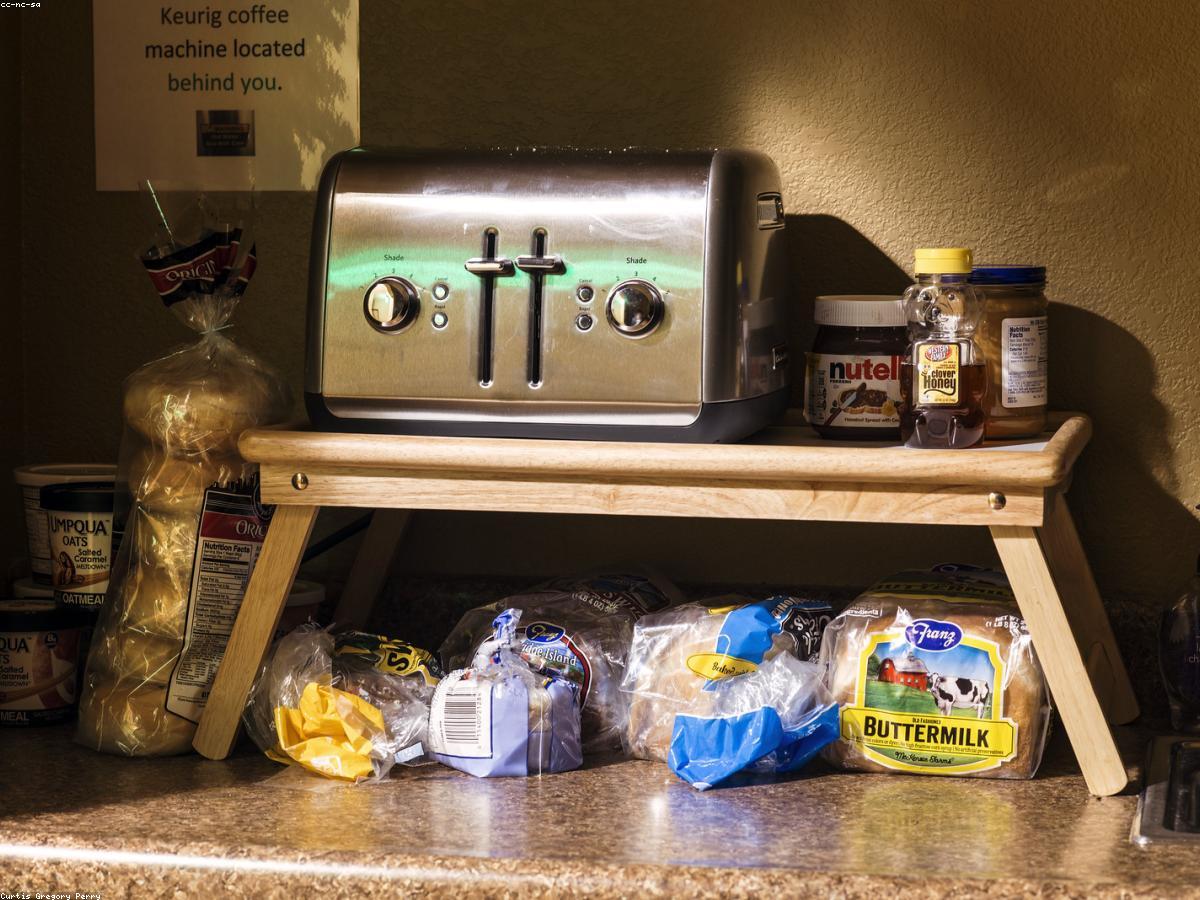 A realistic photo of a bread maker in a domestic environment
